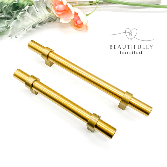 2 brass gold slimline handles showing 96mm and 128mm on plain white background