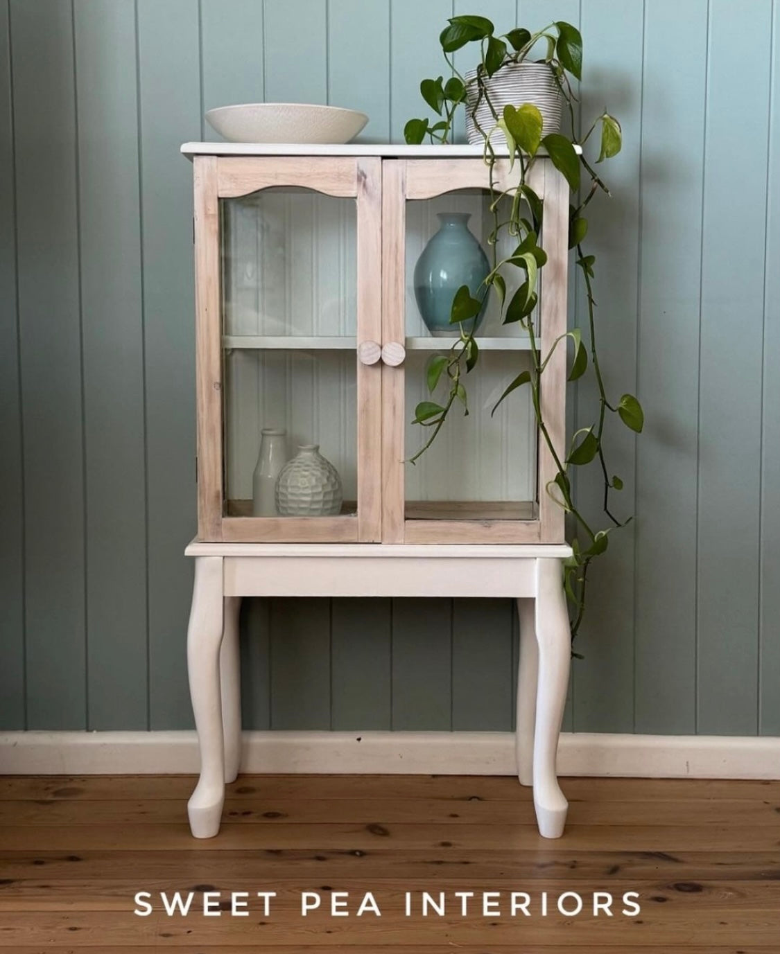 glass cabinet upcycle using raw wooden drawer knobs