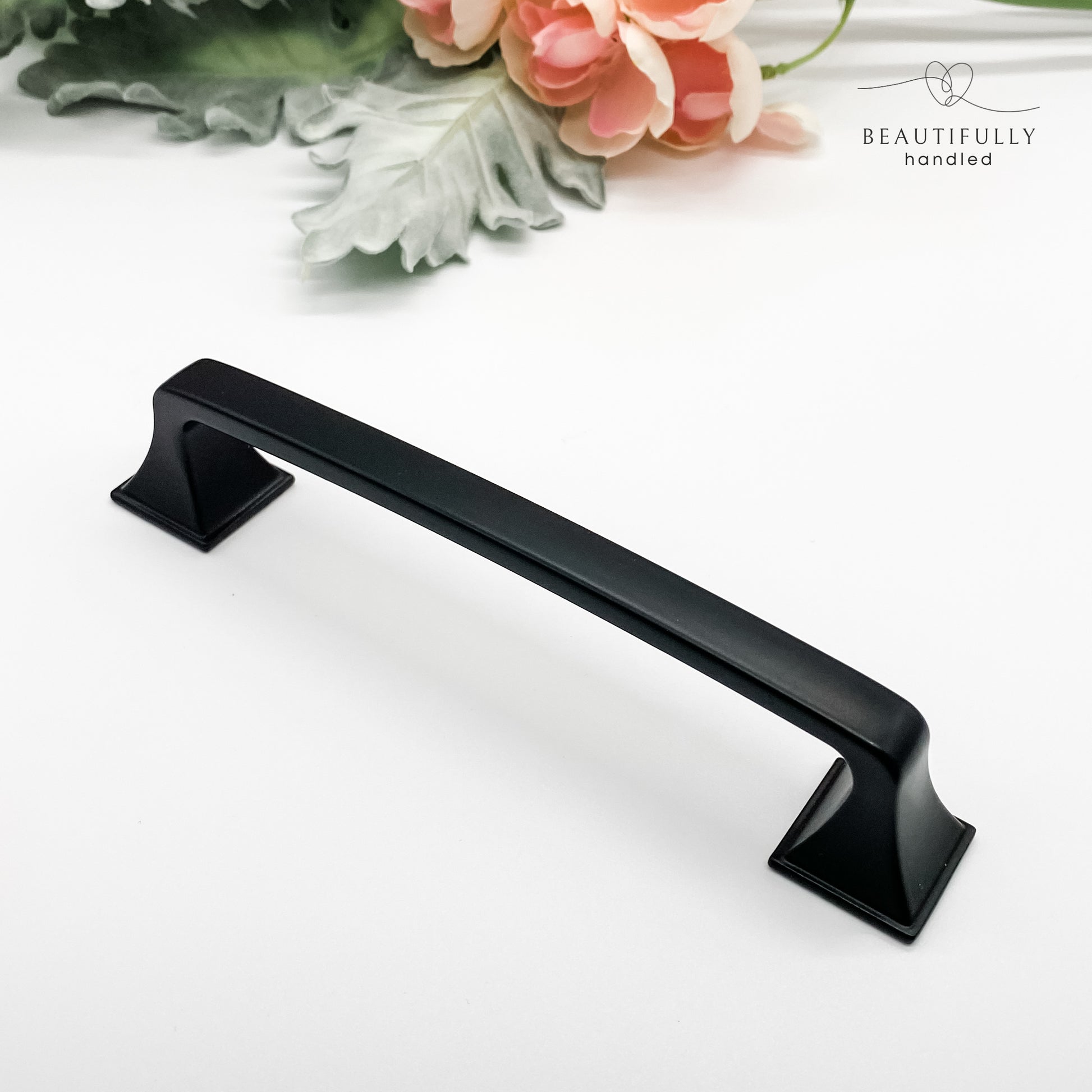 128mm matt black hamptons style kitchen drawer handle on white background