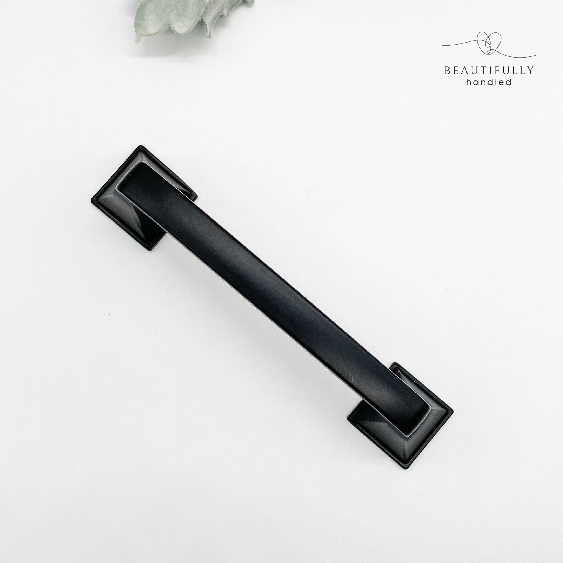 96mm matt black hamptons style kitchen drawer handle on white background