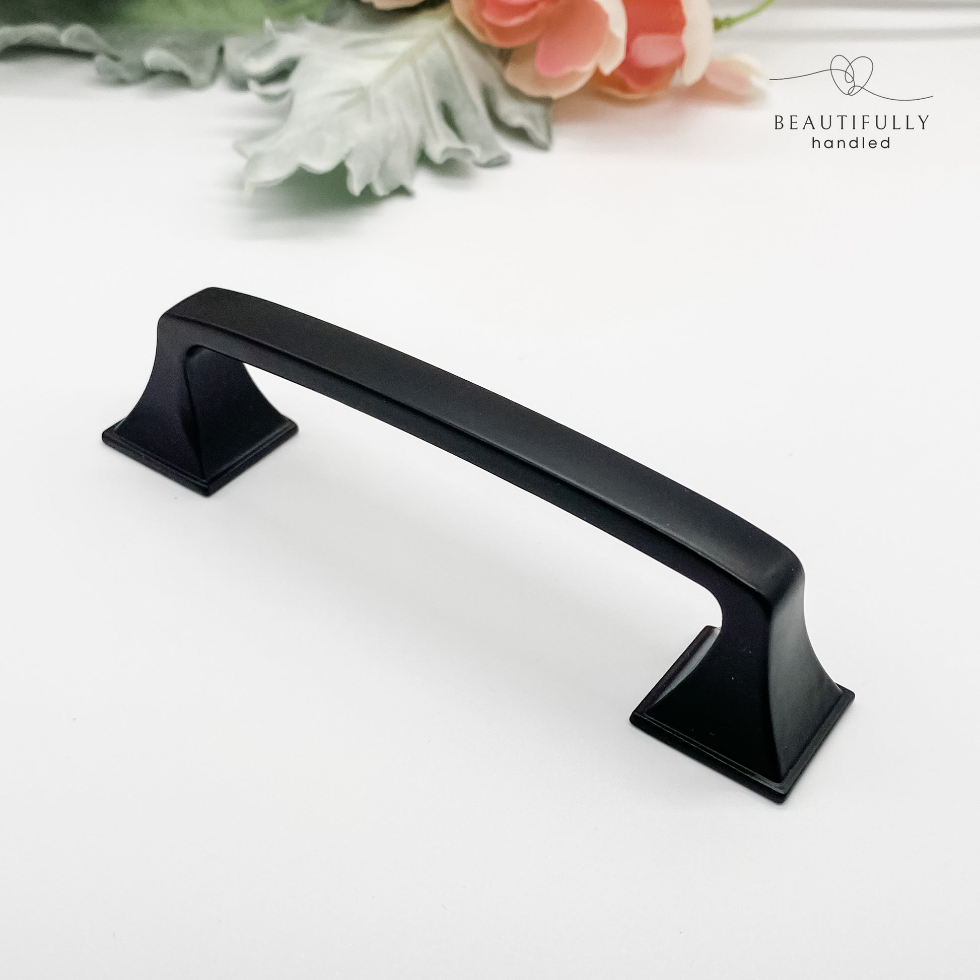 96mm matt black hamptons style kitchen drawer handle on white background side angle