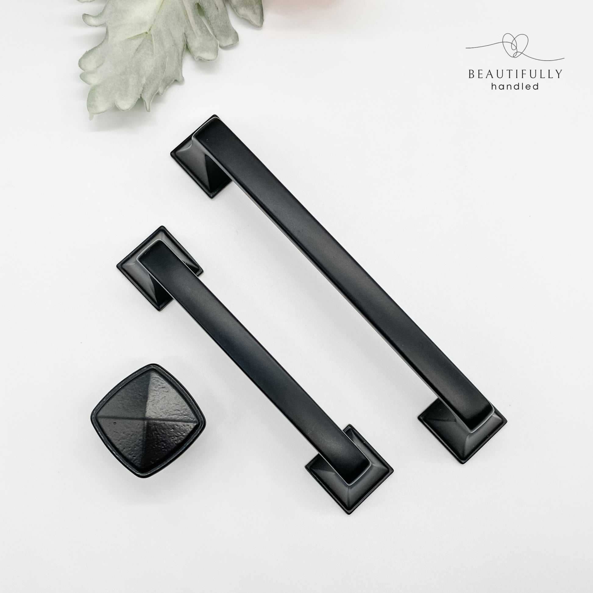 3 sizes of hamptons style matt black kitchen handle in square knob 96mm and 128mm handle on white background