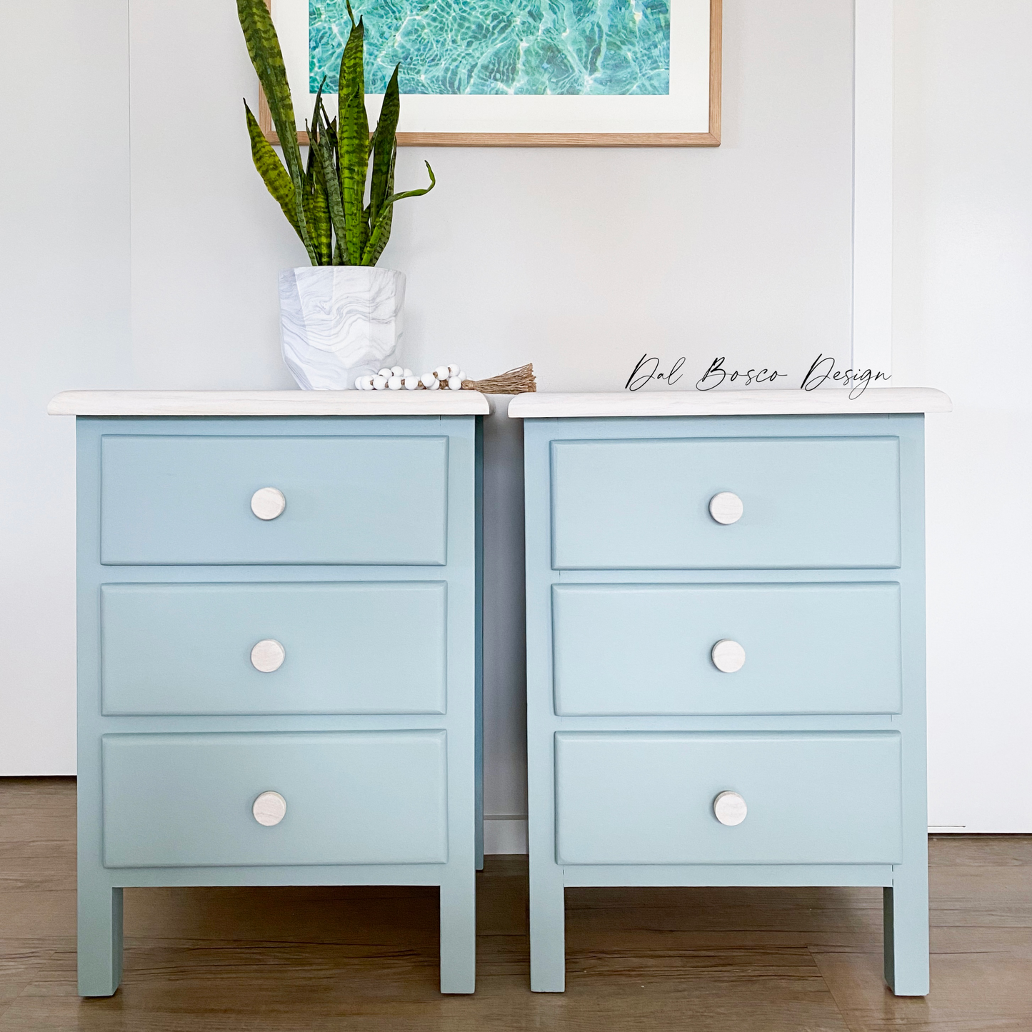 soft blue coastal bedside tables with whitewashed tops using raw wooden drawer knobs 