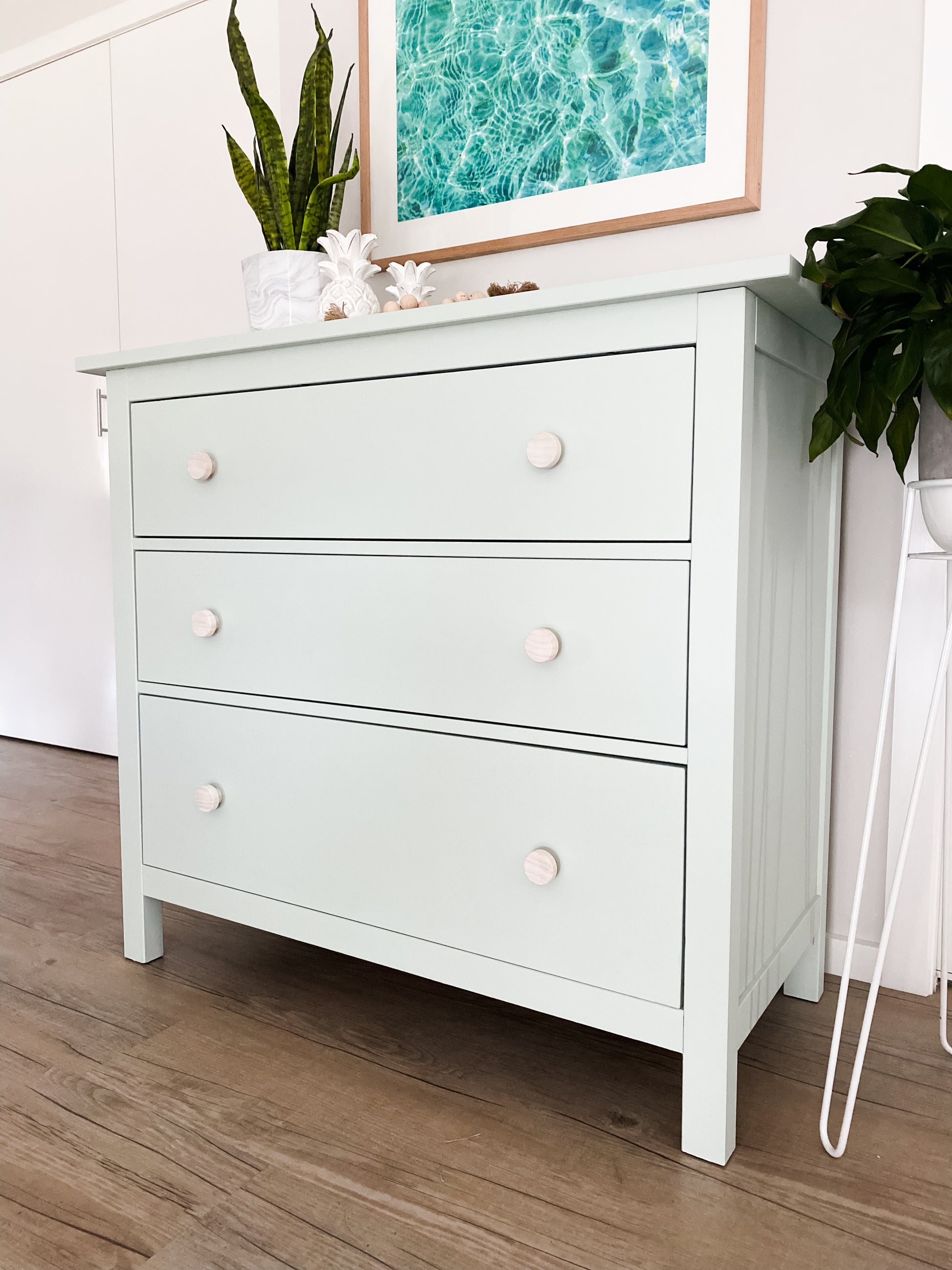 ikea hemnes dresser upcycled in soft green and raw wooden drawer knobs  in coastal room