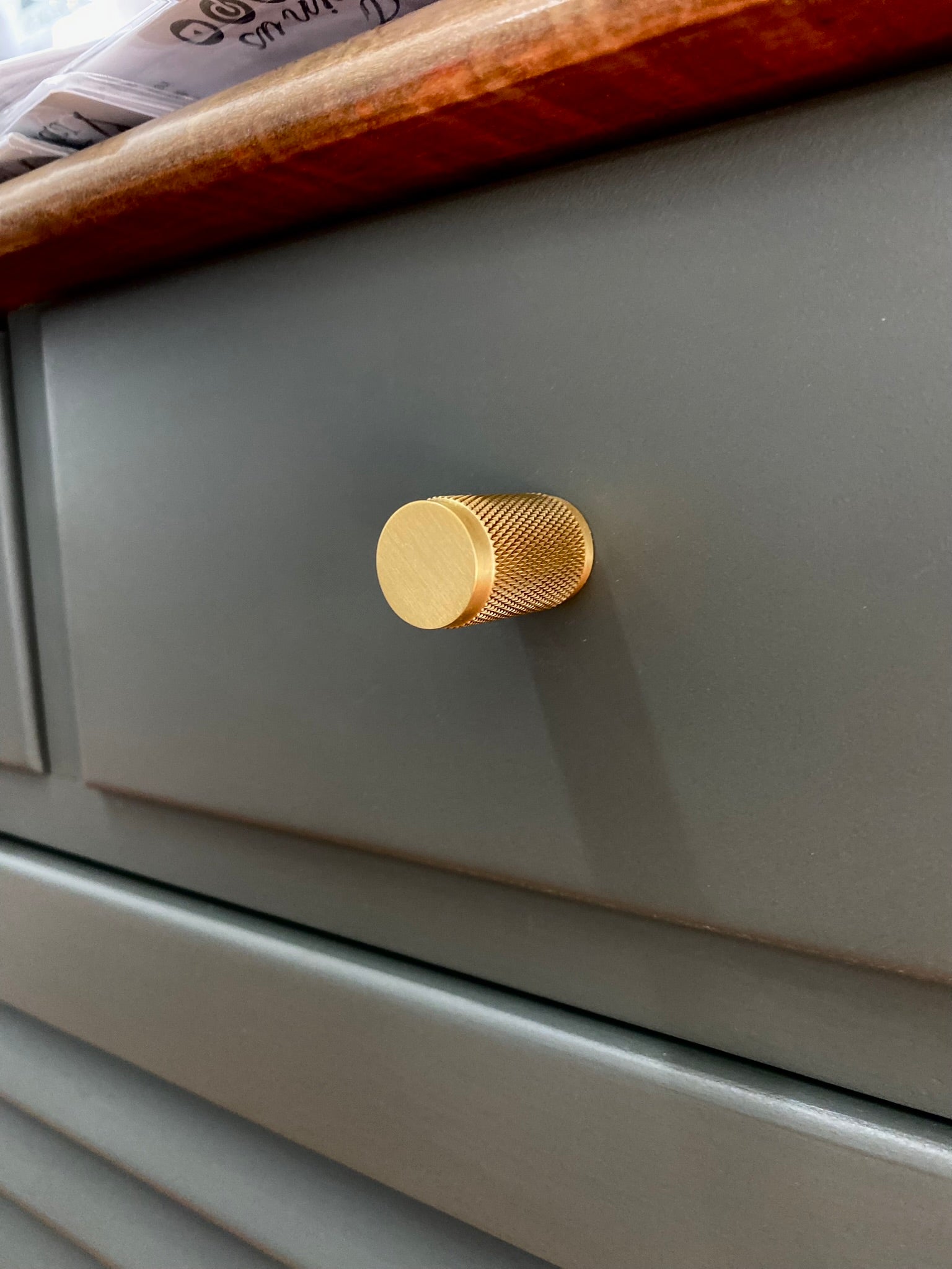 charcoal painted buffet with walnut stained top and solid brass knurled drawer knob