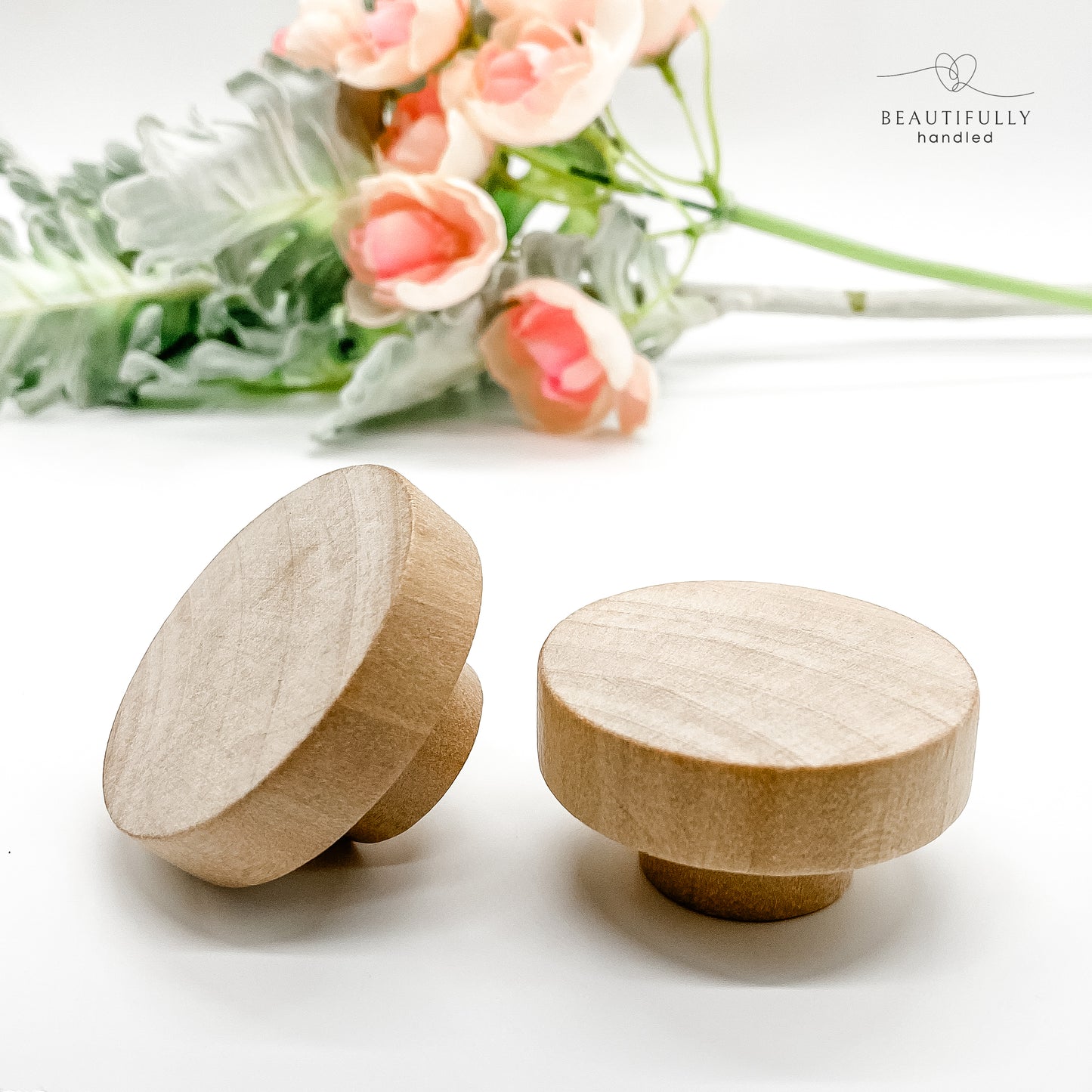 raw unfinished round wooden drawer knobs 50mm on plain white background 