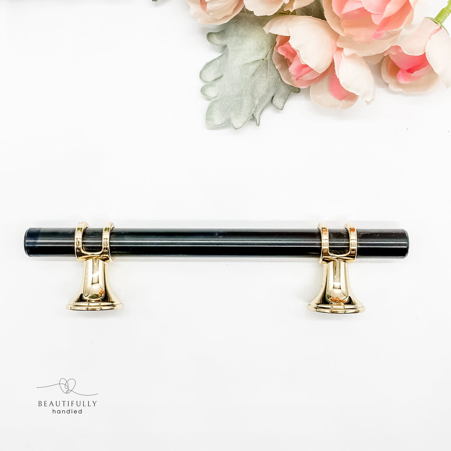 side angle of 96mm black and gold handle on white background 