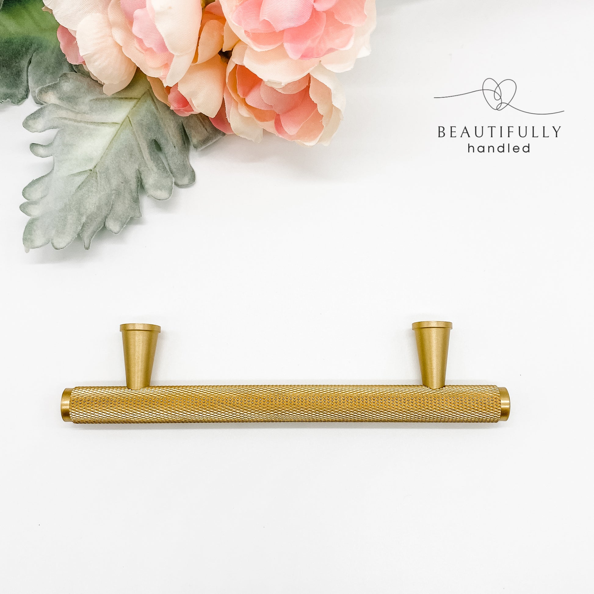 96mm solid brass knurled kitchen cabinet handle from top view on plain white background