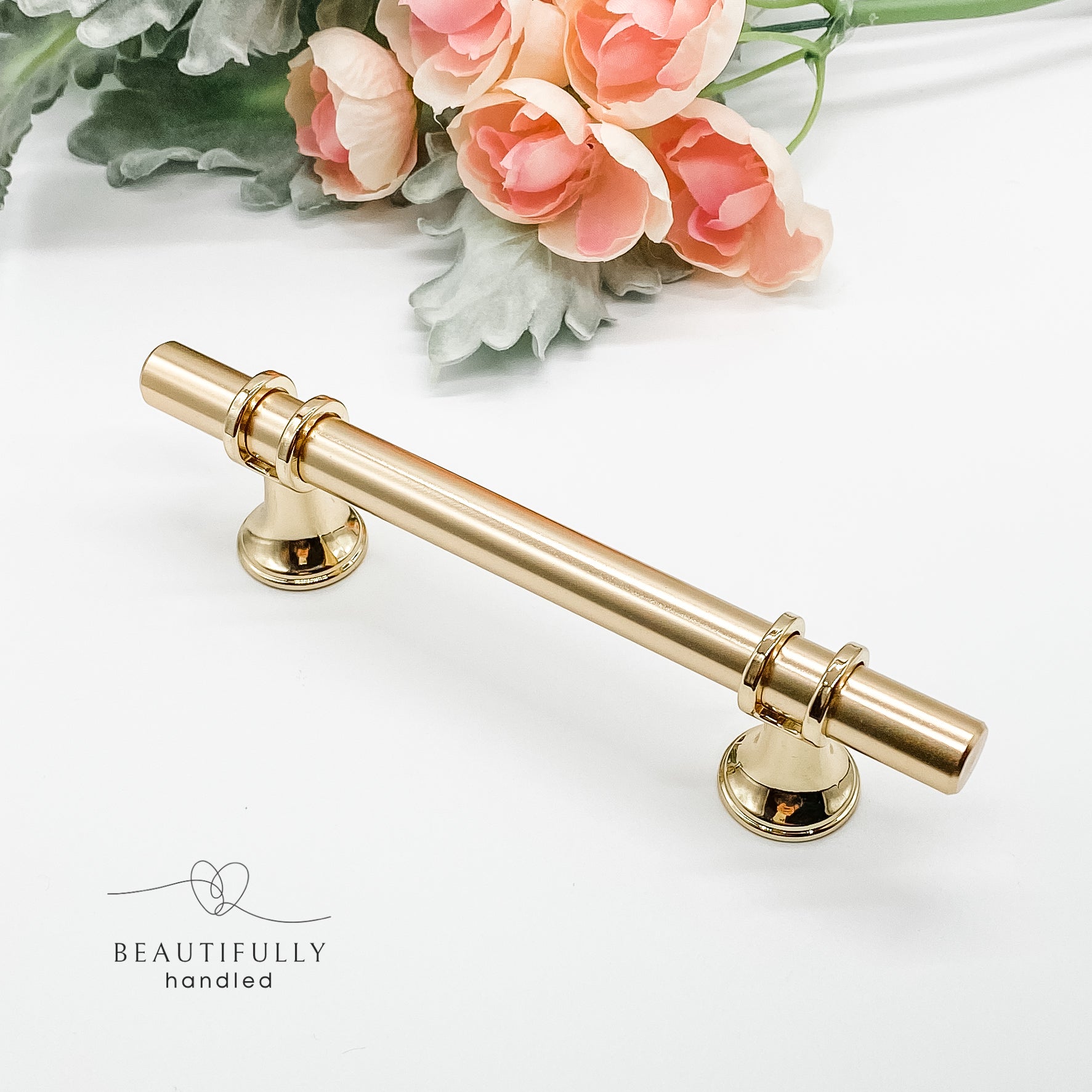 96mm gold drawer handle with gold trim on plain white background