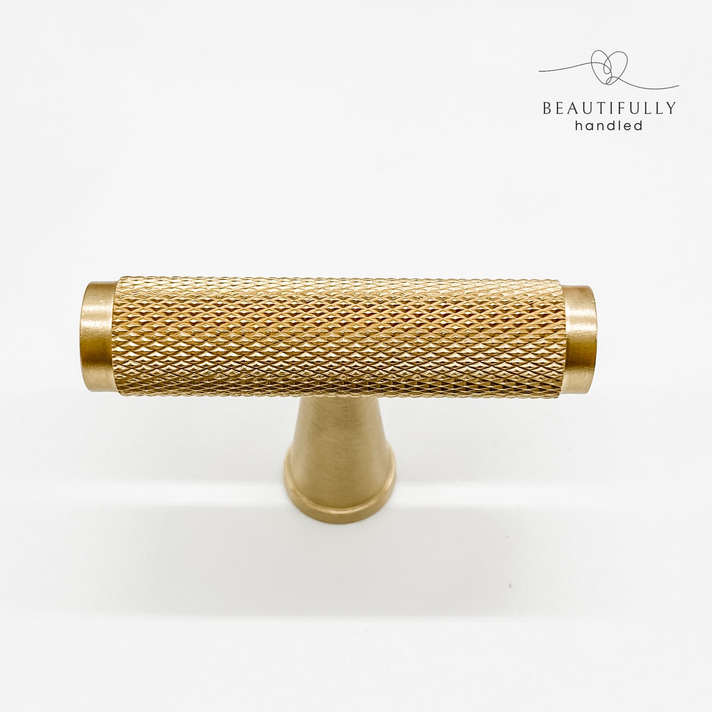 solid brass knurled t bar drawer handle showing all detail of knurling on white background